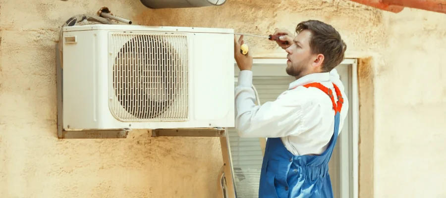 hvac-technician-working-capacitor-part-condensing-unit-male-worker-repairman-uniform-repairing-adjusting-conditioning-system-diagnosing-looking-technical-issues